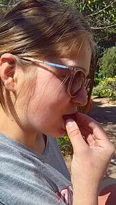 Abbey enjoying a strawberry guava