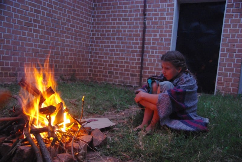 Abbey enjoys sitting at the campfire