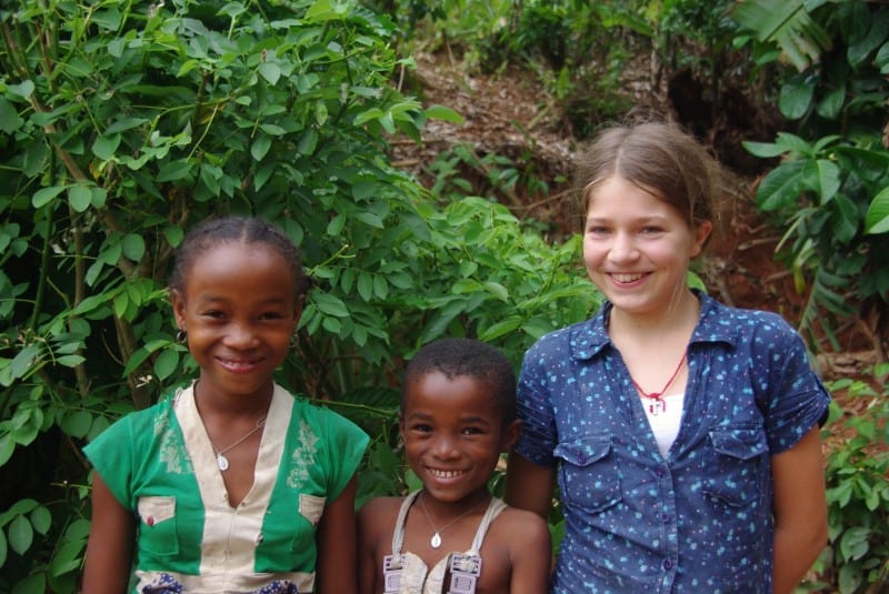 These two happy kids are going to school.